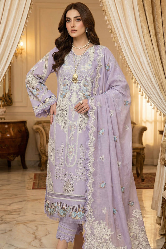 Woman in a lavender embroidered outfit standing in an elegant room with curtains and furniture.
