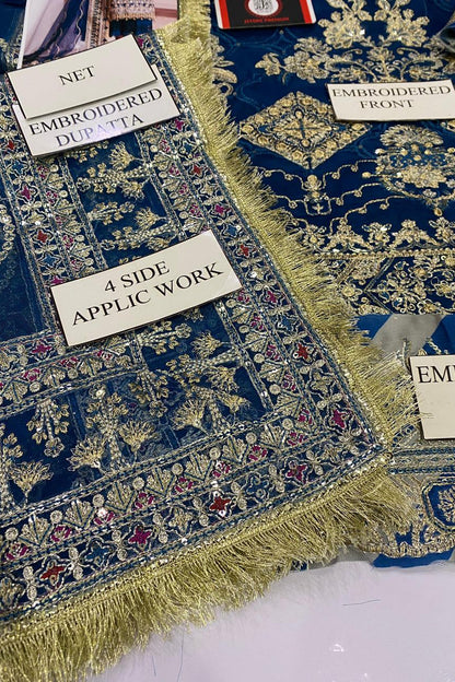 Embroidered fabric with labels indicating design details on a blue background